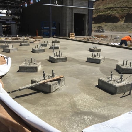 Concrete slab with anchor bolts