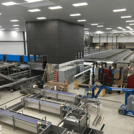 Interior concrete slabs for fruit processing facility