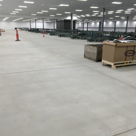 Interior concrete slabs for fruit processing facility
