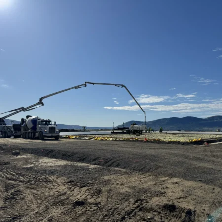 Concrete pump pouring concrete during flatwork project