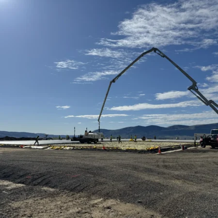 Concrete pump pouring concrete during flatwork project