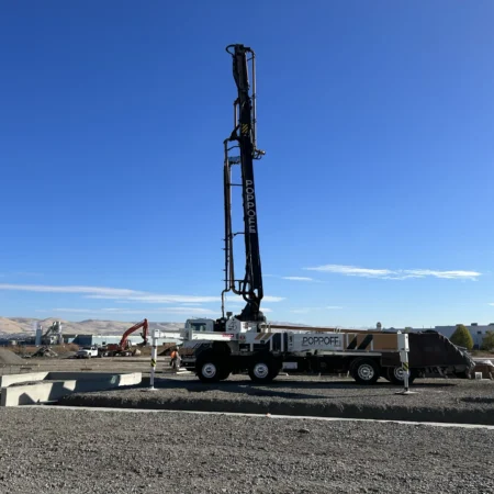 Concrete pump with boom in upright position